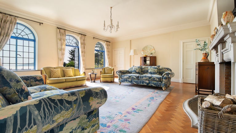 The drawing room at Portland House, with patio doors onto the lower terrace, Dorset